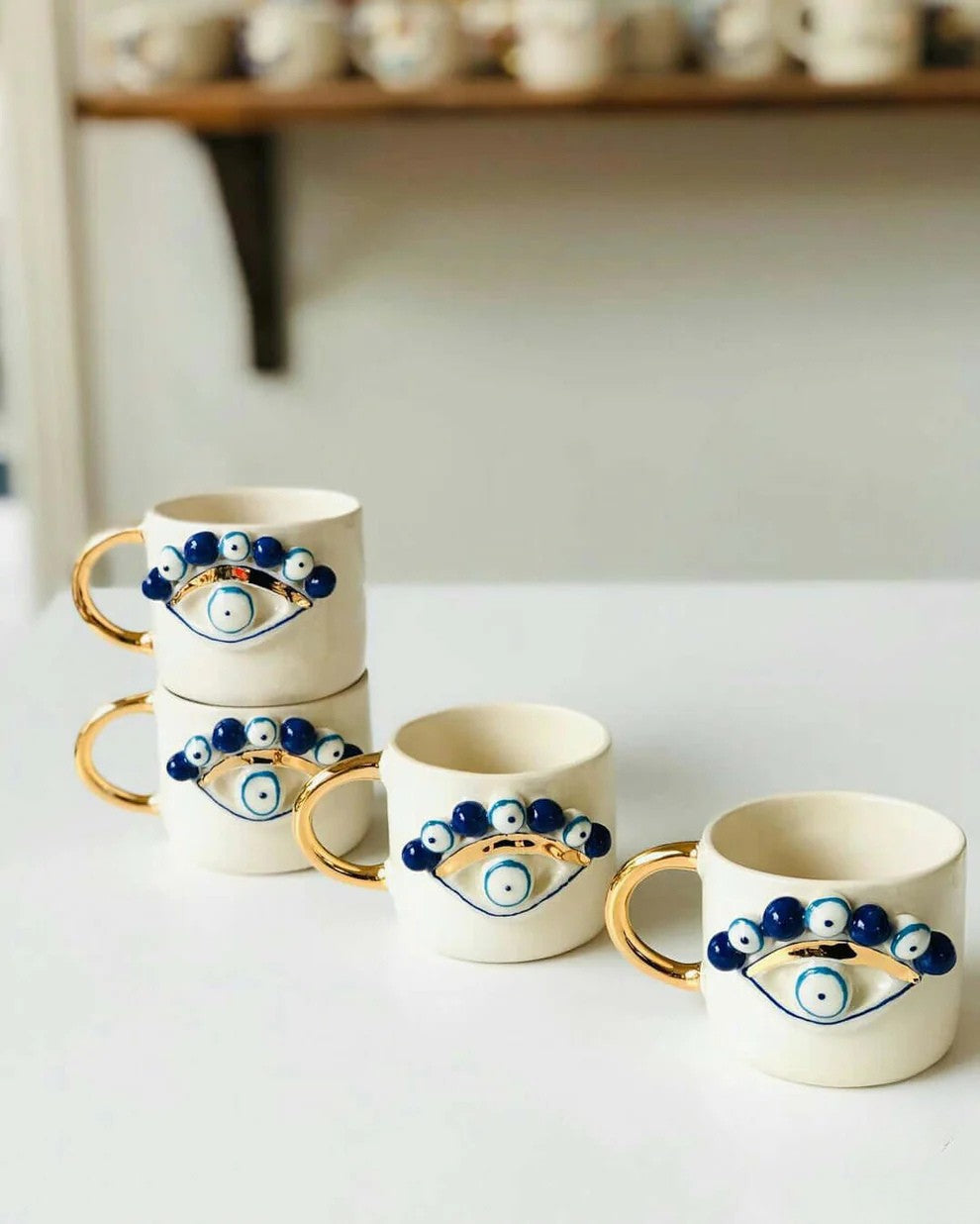 Handmade Evil Eye Ceramic Mug – Artisan Pottery with Gold Handle