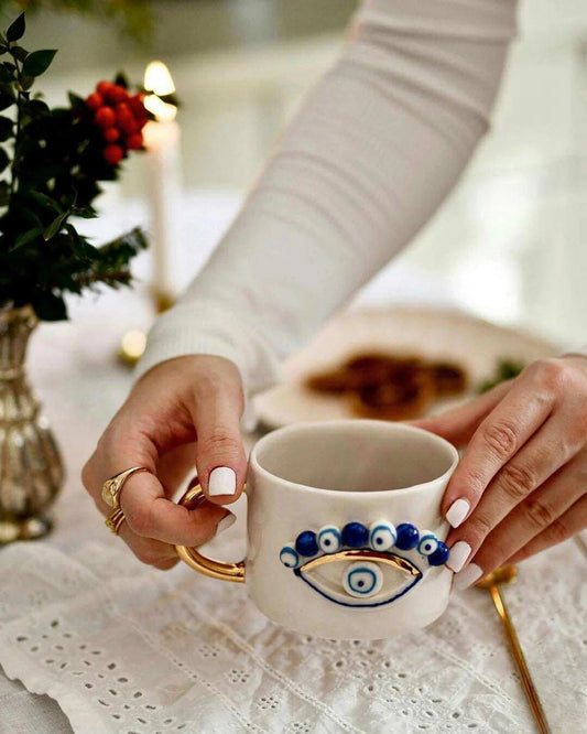 Handmade Evil Eye Ceramic Mug – Artisan Pottery with Gold Handle