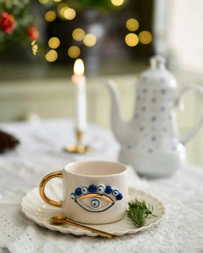 Handmade Evil Eye Ceramic Mug – Artisan Pottery with Gold Handle