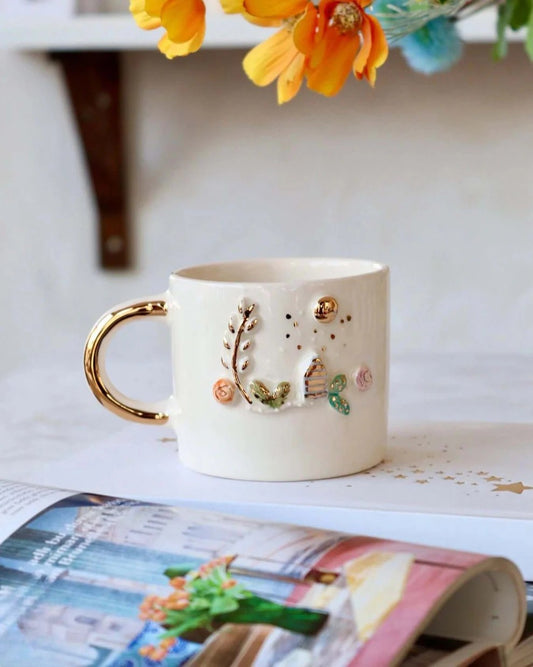 Handcrafted Ceramic Mug with Golden Handle – 3D Cottage Garden Design